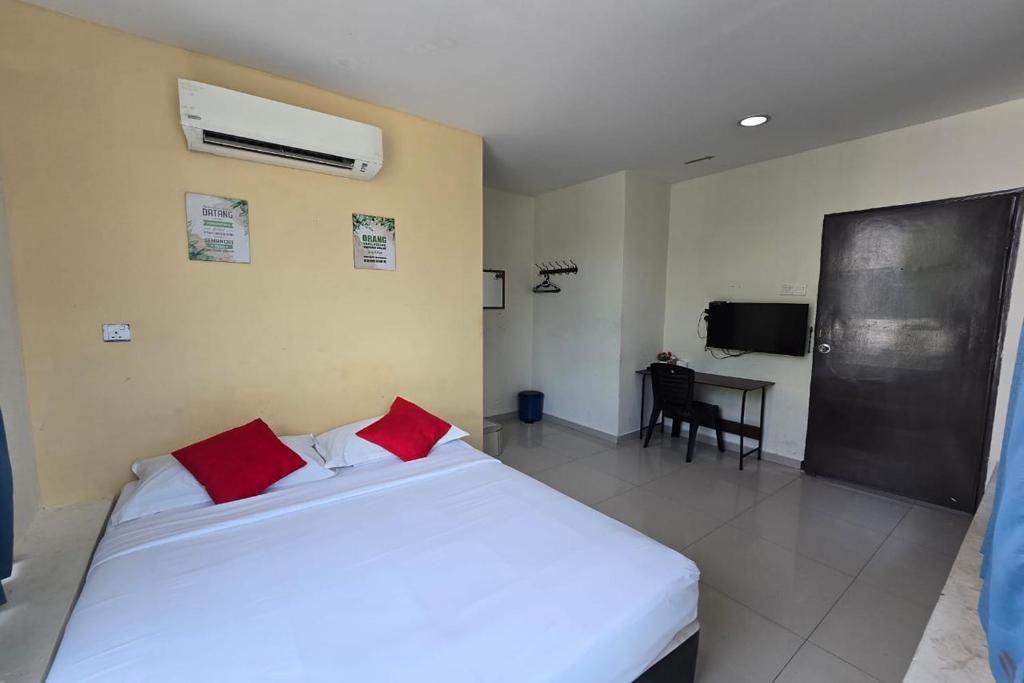 Postel nebo postele na pokoji v ubytování Hotel Inap Sri Gombak