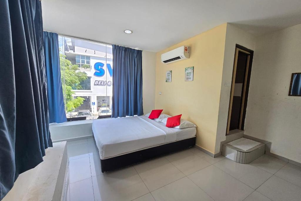 Postel nebo postele na pokoji v ubytování Hotel Inap Sri Gombak