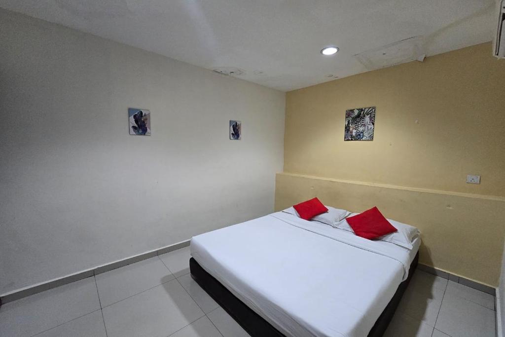 Postel nebo postele na pokoji v ubytování Hotel Inap Sri Gombak