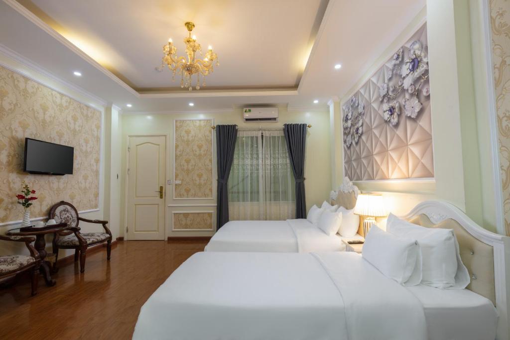 Postel nebo postele na pokoji v ubytování My Moon Hotel Hanoi