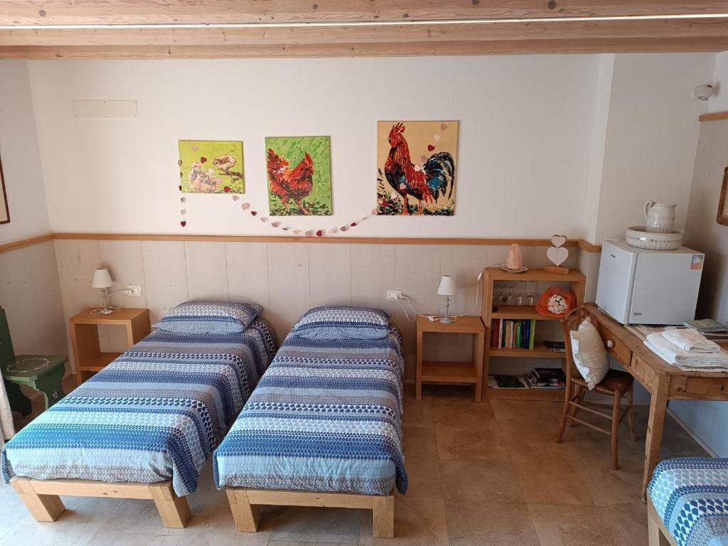Postel nebo postele na pokoji v ubytování Locazione turista Cocodè