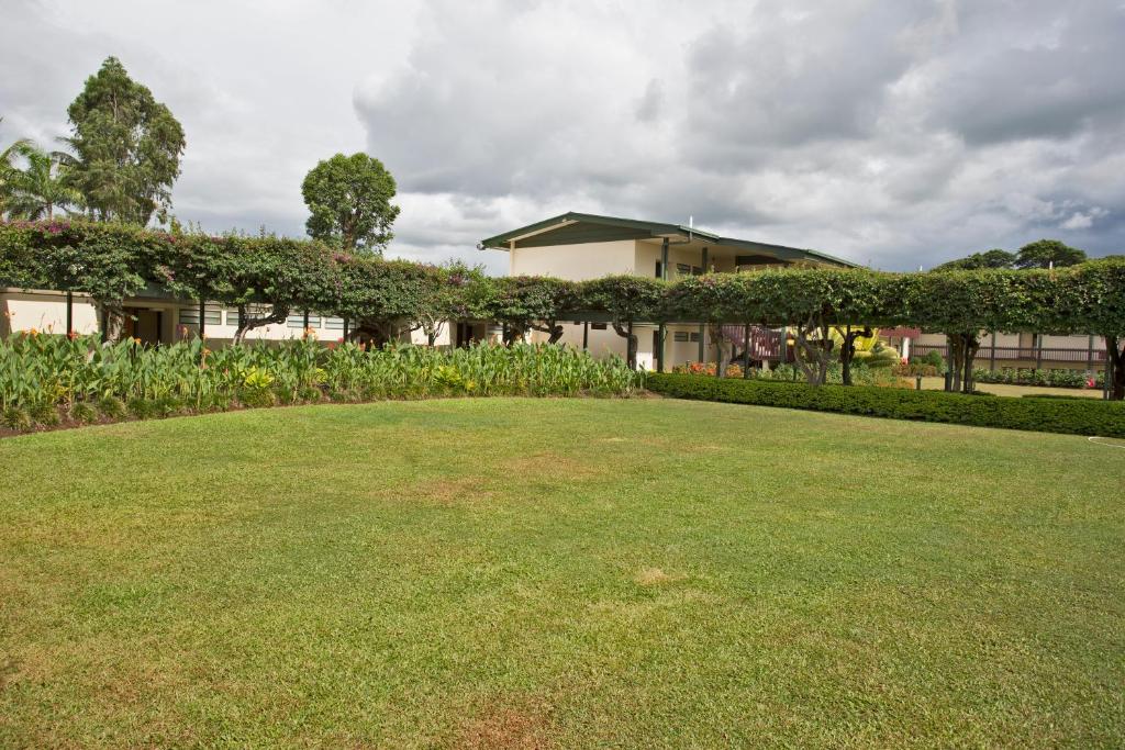 a large lawn in front of a building at Fiji Gateway Hotel in Nadi
