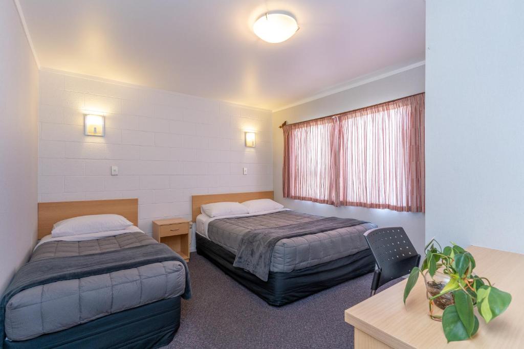 Postel nebo postele na pokoji v ubytování Loredo Motel