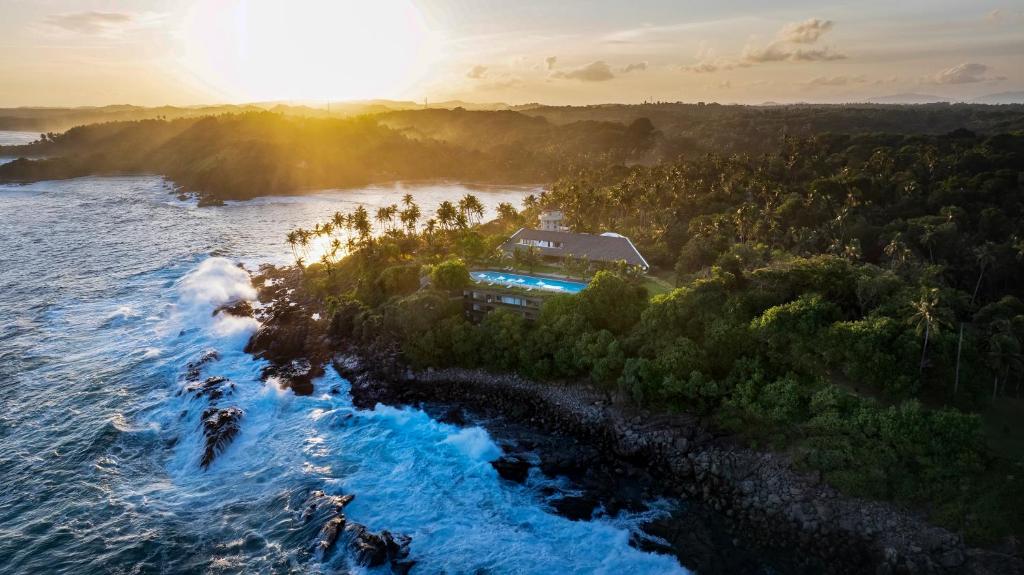 an aerial view of a house on a island in the ocean at Uga Prāva - Tangalle in Tangalle