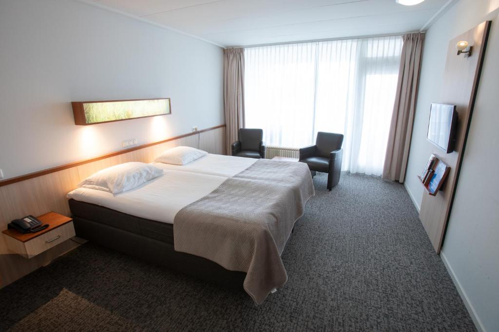 Postel nebo postele na pokoji v ubytování Hotel Princenhof