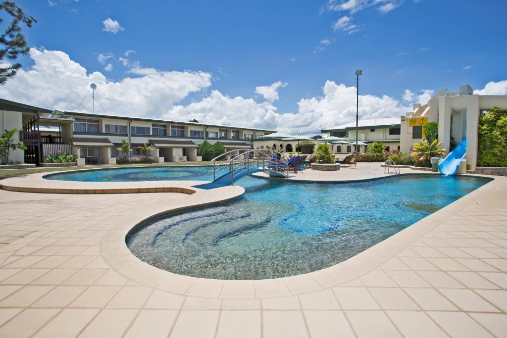 a pool in the middle of a courtyard at Fiji Gateway Hotel in Nadi