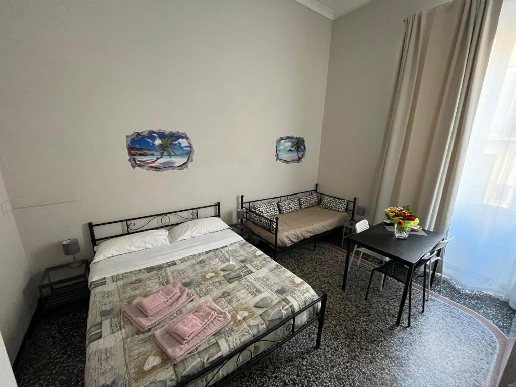 Postel nebo postele na pokoji v ubytování Le stanze della Lanterna