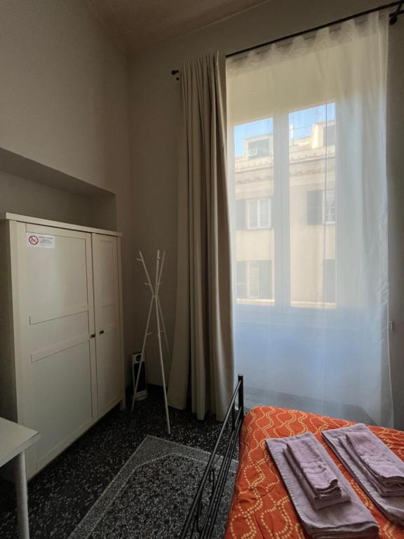 Postel nebo postele na pokoji v ubytování Le stanze della Lanterna