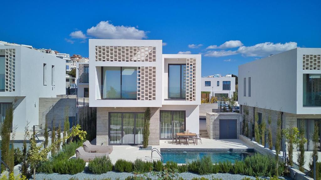 a rendering of a house with a swimming pool at Oasis Villa 3 in Khlorakas