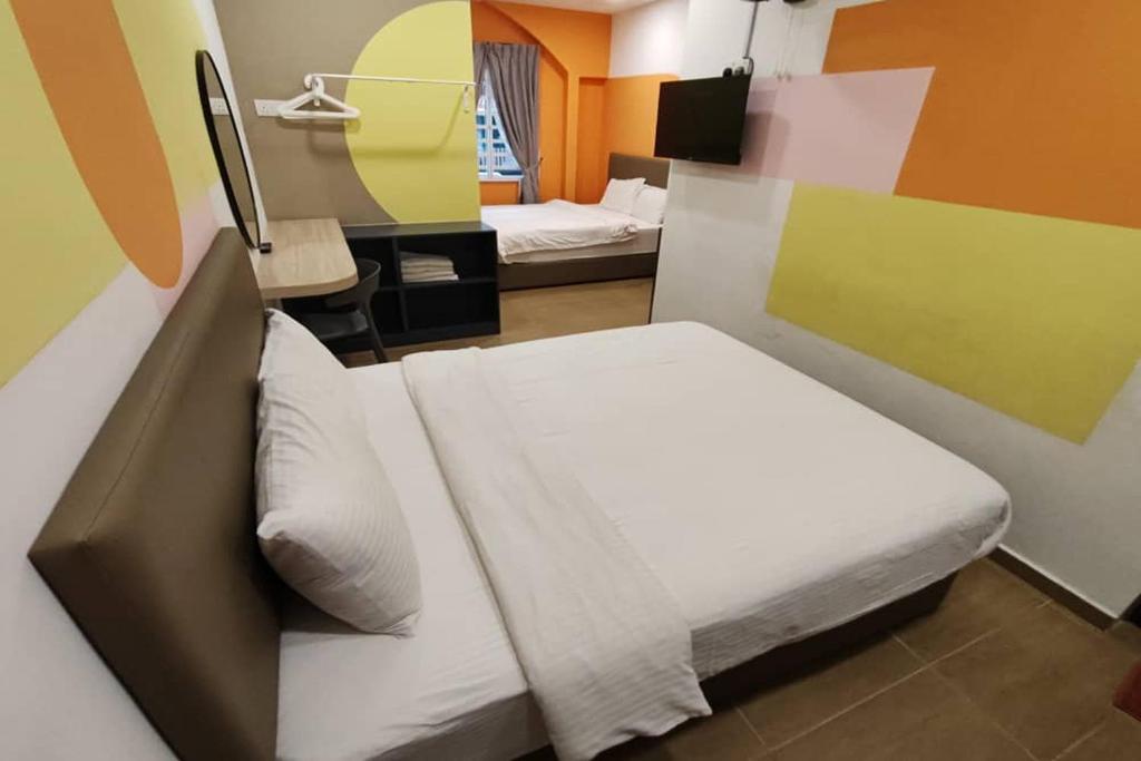 Postel nebo postele na pokoji v ubytování Moon Hotel, Cameron Highland