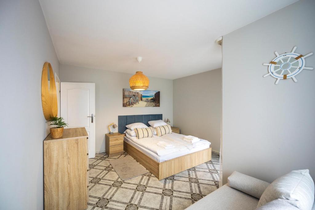 Posteľ alebo postele v izbe v ubytovaní Apartament Reymonta 15 SurfingBird Kołobrzeg