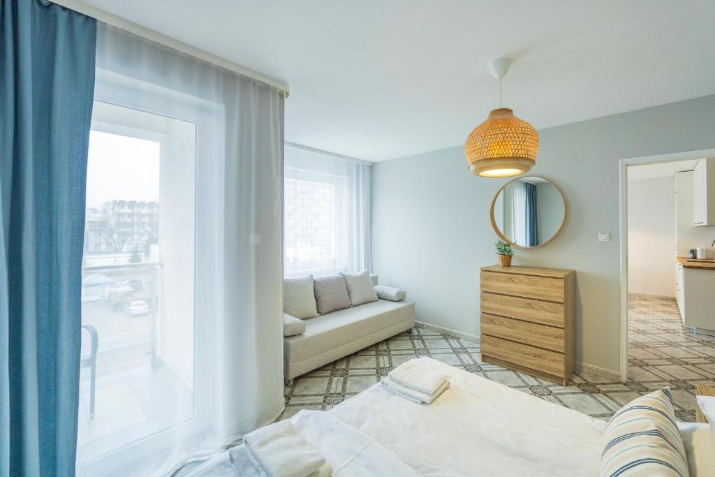 Posteľ alebo postele v izbe v ubytovaní Apartament Reymonta 15 SurfingBird Kołobrzeg