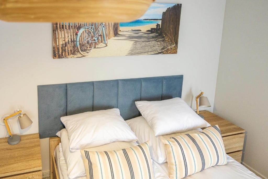 Posteľ alebo postele v izbe v ubytovaní Apartament Reymonta 15 SurfingBird Kołobrzeg