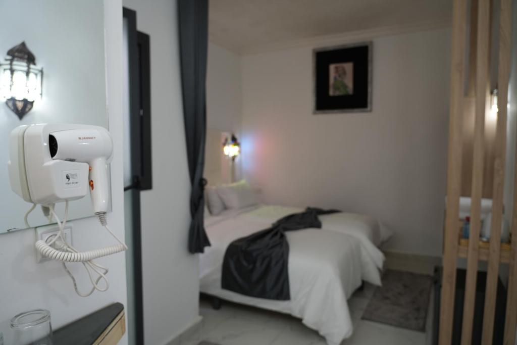 Postel nebo postele na pokoji v ubytování Dar Naciria