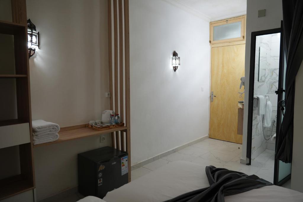 Postel nebo postele na pokoji v ubytování Dar Naciria