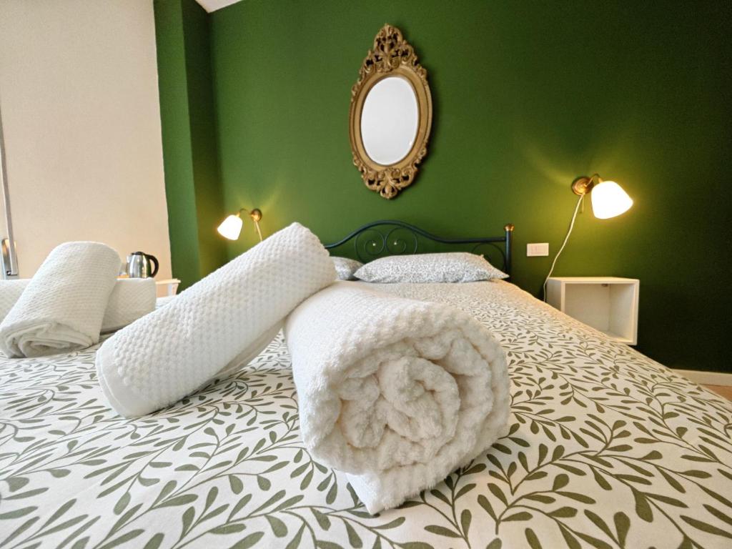 Postel nebo postele na pokoji v ubytování b&b il Melograno
