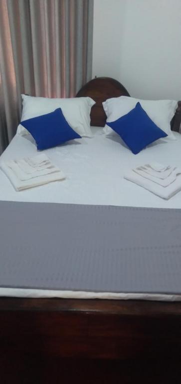 Postel nebo postele na pokoji v ubytování Kulassa Homes