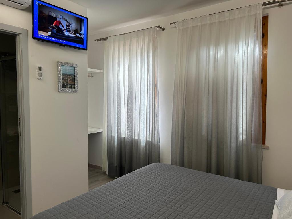 TV a/nebo společenská místnost v ubytování Dolce Dormire