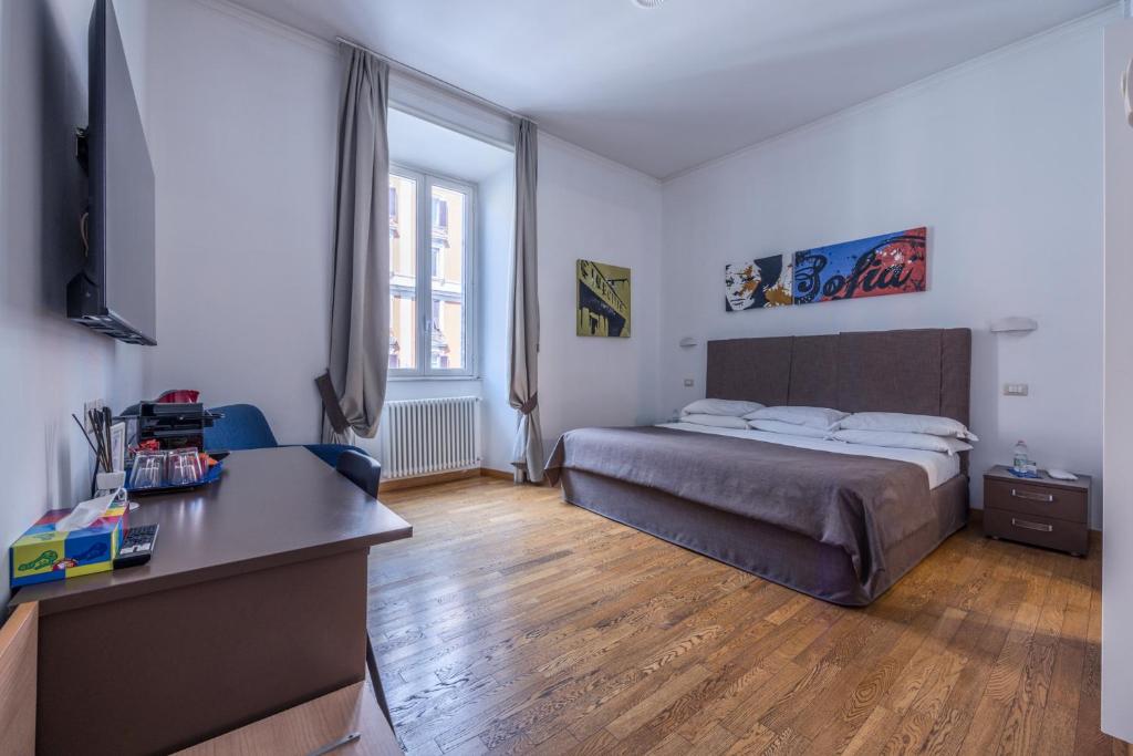Postel nebo postele na pokoji v ubytování Rome Armony Suites