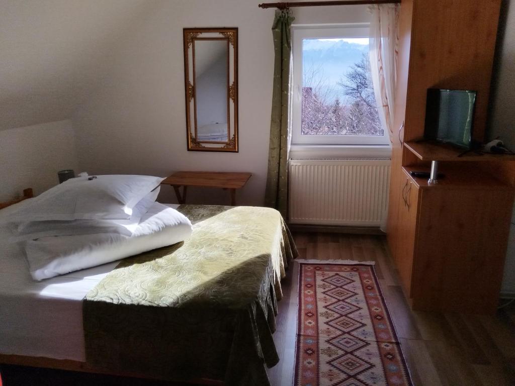 Postel nebo postele na pokoji v ubytování Garofita Pietrei Craiului
