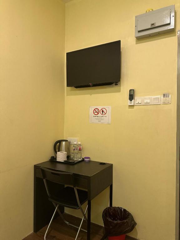 TV a/nebo společenská místnost v ubytování Serian Transit Inn