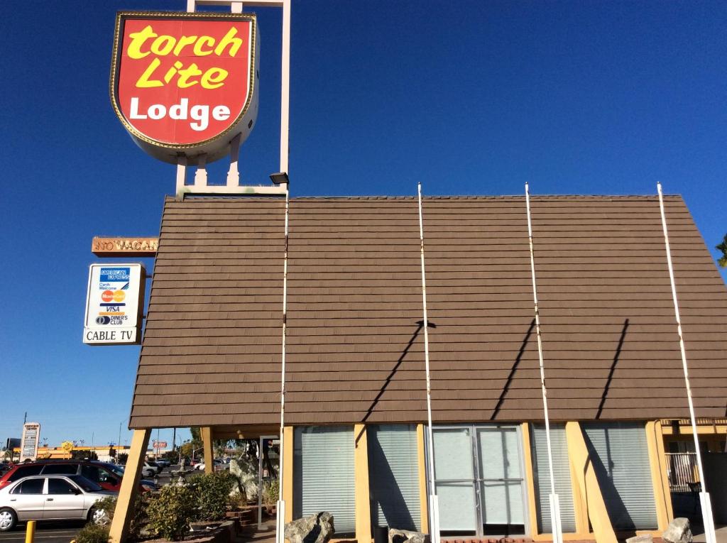 a fast food restaurant with a sign on top of it at Torch Lite Lodge in Yuma