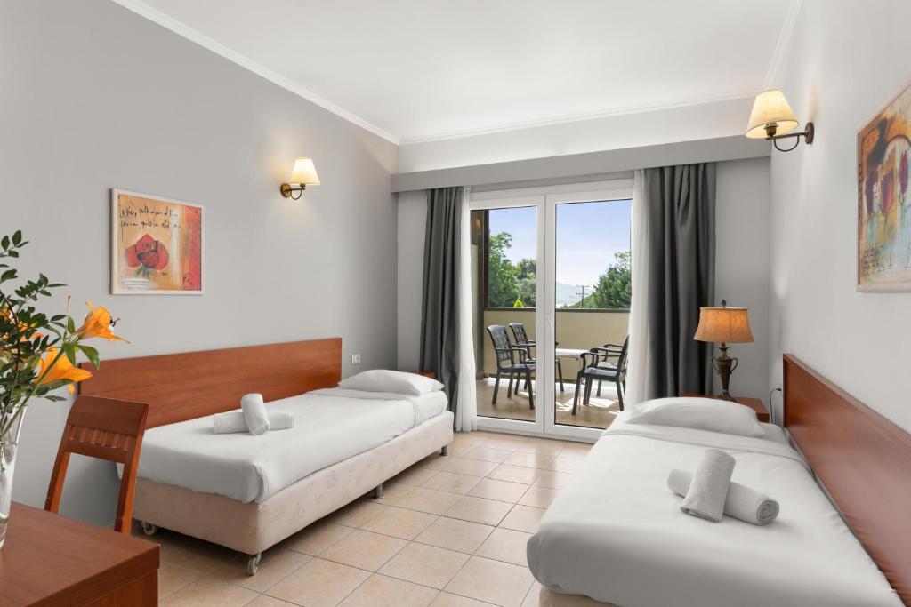 Letto o letti in una camera di Ariti Grand Hotel