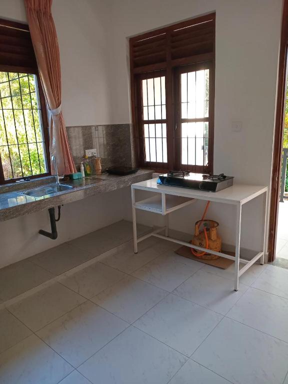 Kuchyň nebo kuchyňský kout v ubytování Oasis Suite