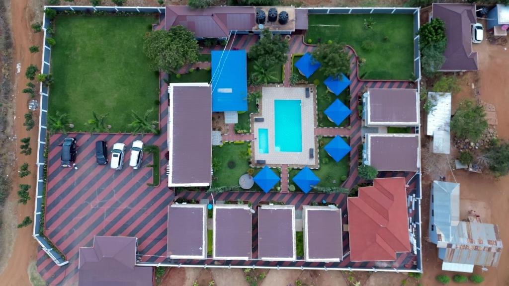 an aerial view of a house with a swimming pool at Johnsons Villas in Zame