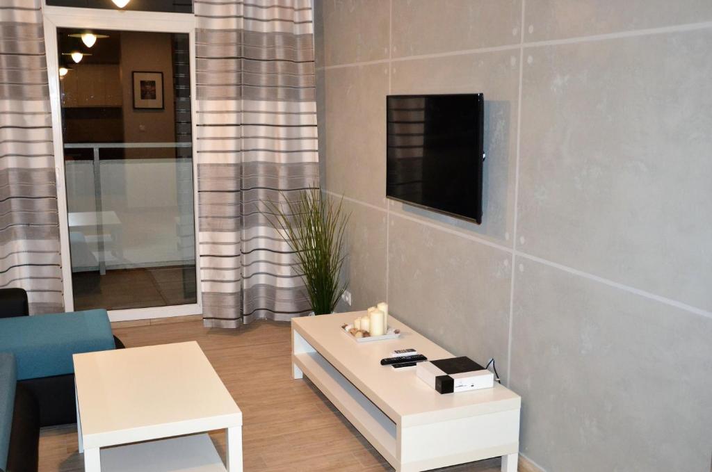Telewizja i/lub zestaw kina domowego w obiekcie Apartamenty Krawiecka