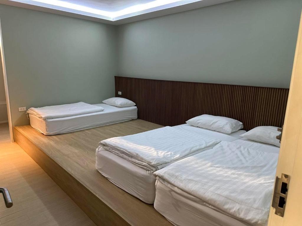 Kitzio House Hotel Huai Kwangにあるベッド
