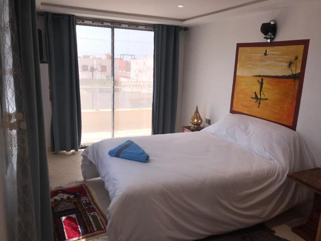 Una cama o camas en una habitación de Les Bains de Mirleft