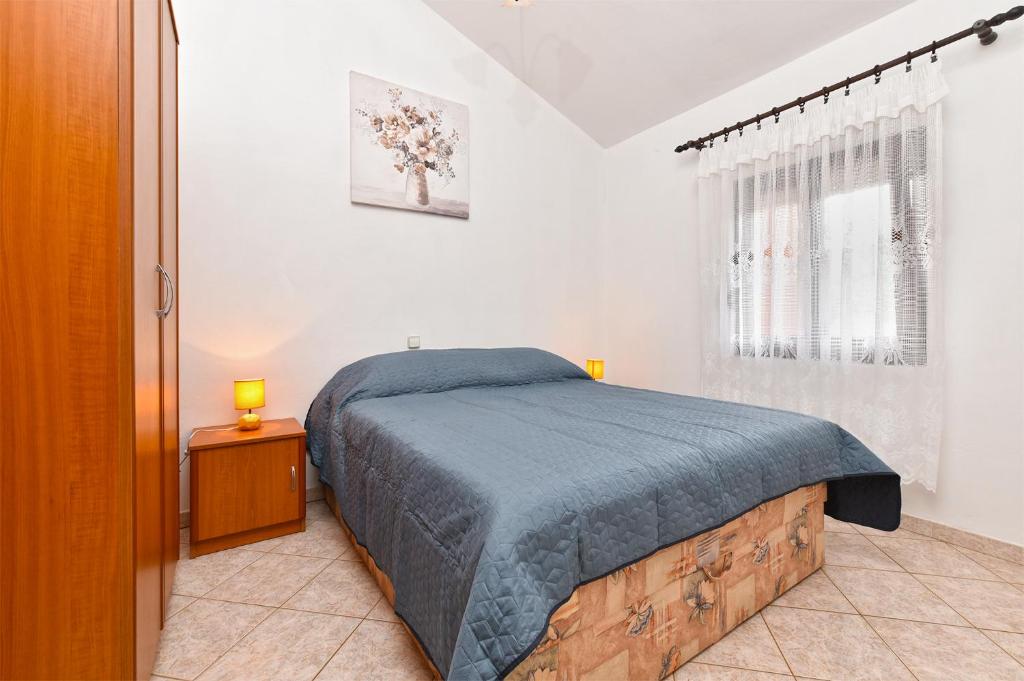 Postel nebo postele na pokoji v ubytování Apartments Miranda 1858