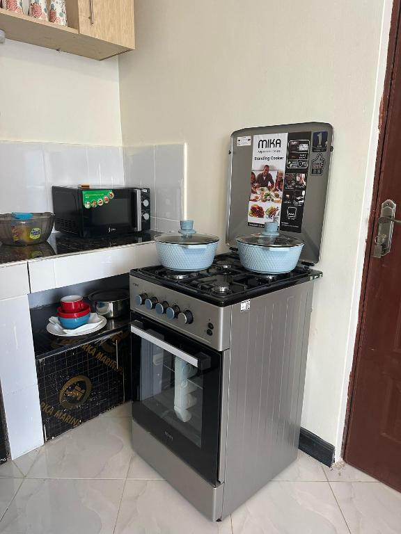 Kuchyň nebo kuchyňský kout v ubytování Ecostay Studio 305