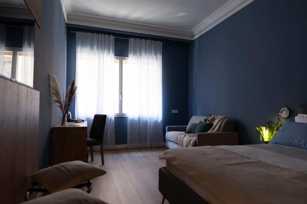 Postel nebo postele na pokoji v ubytování Quattro Canti Deluxe