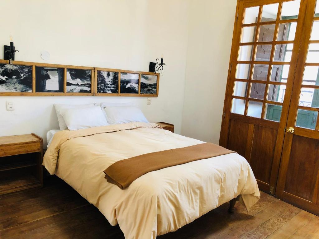 Postel nebo postele na pokoji v ubytování Hostal Qorichaska
