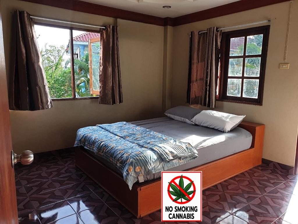 Postel nebo postele na pokoji v ubytování Tommy Resort Koh Tao
