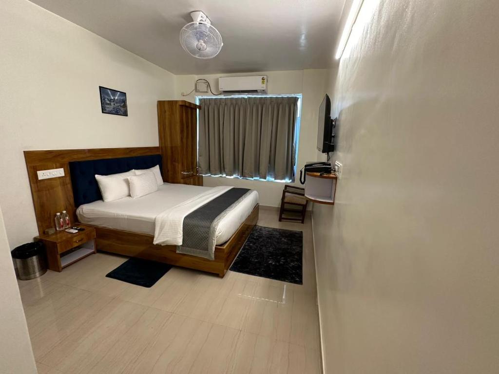 Postel nebo postele na pokoji v ubytování HOTEL DADOs INN