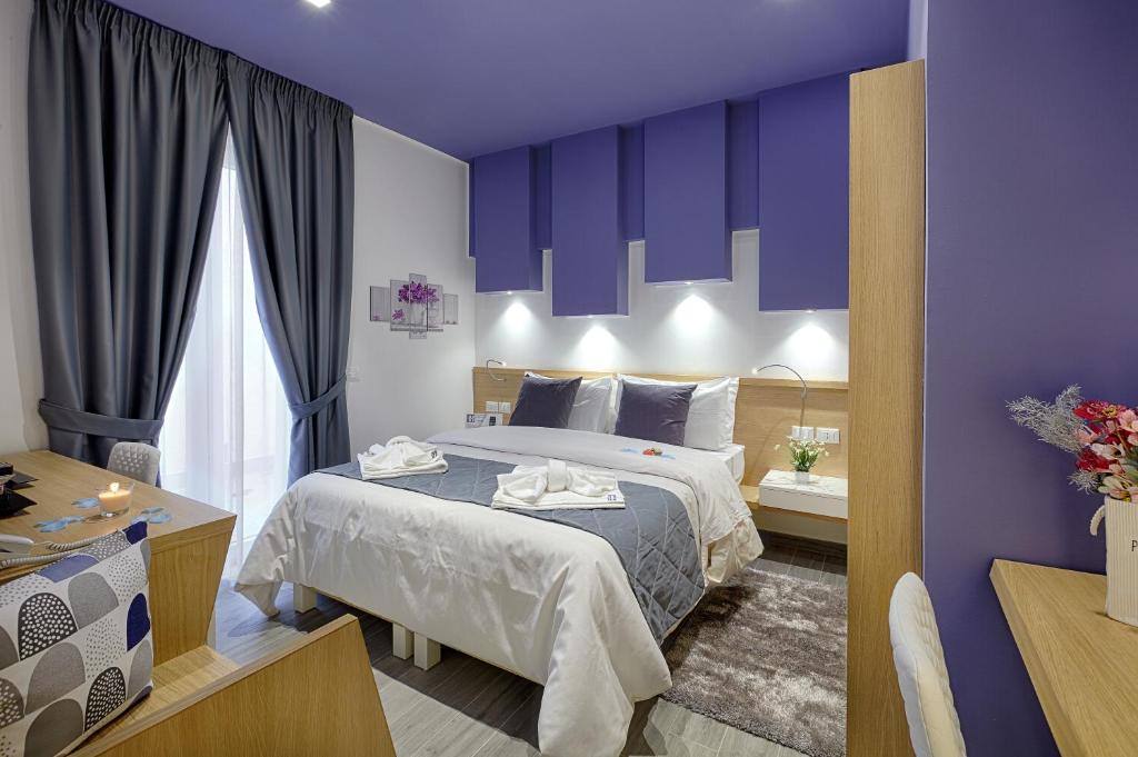 Postel nebo postele na pokoji v ubytování Hospitality Hotel