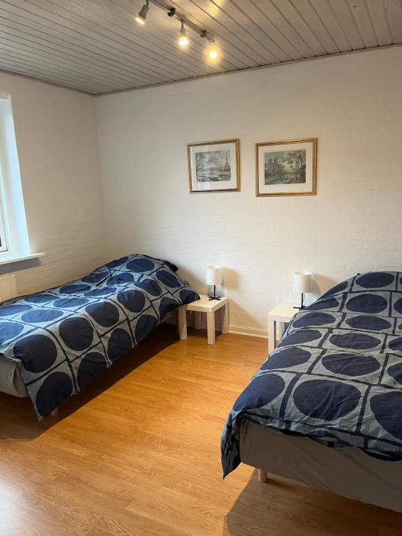 Postel nebo postele na pokoji v ubytování Ferielejlighed i Iller ved Ans