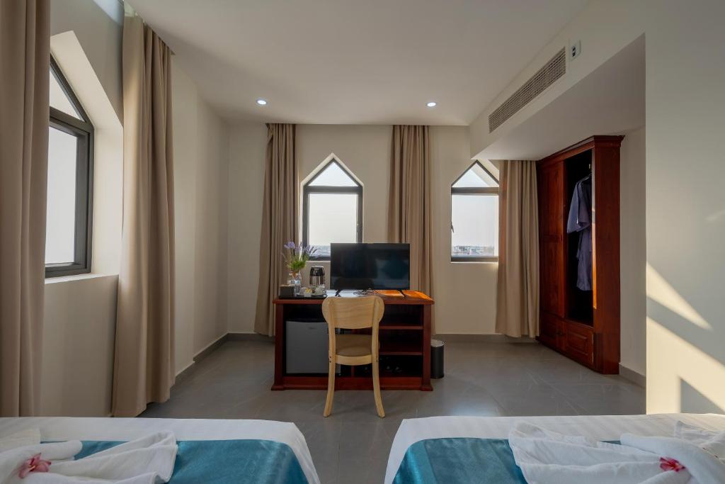Postel nebo postele na pokoji v ubytování Angkor Channary Hotel