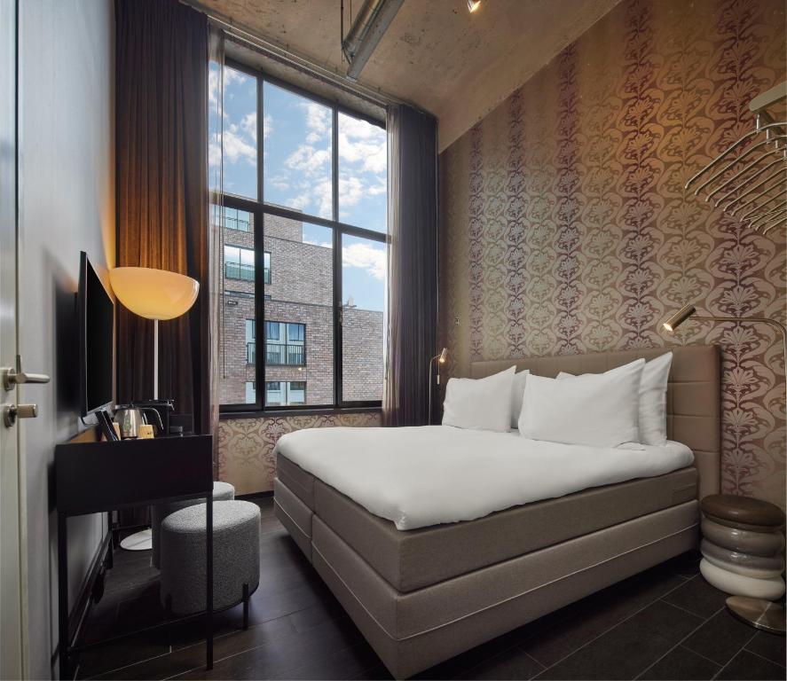 Postel nebo postele na pokoji v ubytování WestCord Hotel Eindhoven