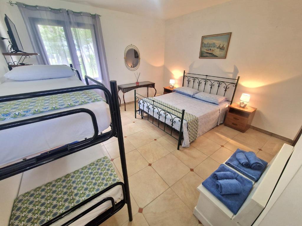Postel nebo postele na pokoji v ubytování Agriturismo Twin Tails - Sant'Isidoro