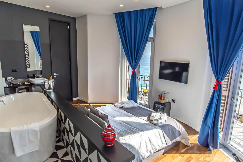 Posteľ alebo postele v izbe v ubytovaní Gram Suites