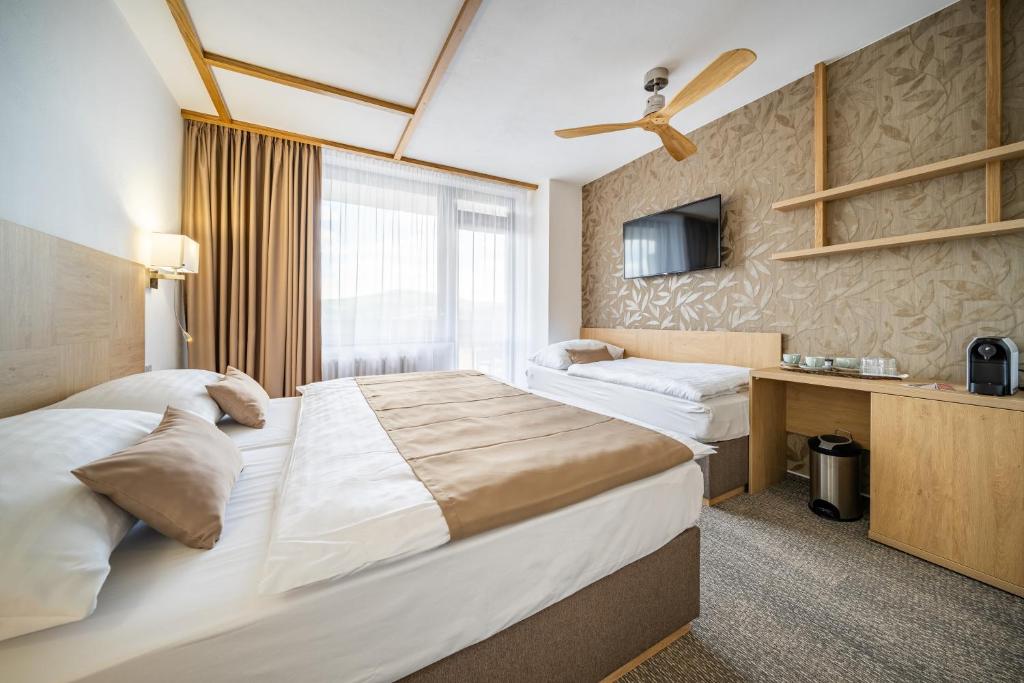 Postel nebo postele na pokoji v ubytování Hotel Adamantino