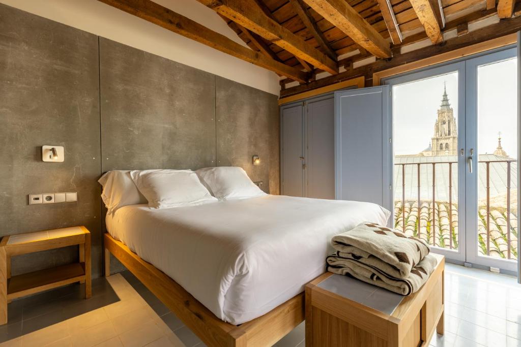 Postel nebo postele na pokoji v ubytování Hotel Carlos V