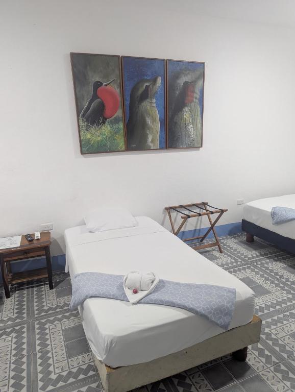 Postel nebo postele na pokoji v ubytování Hostal Gardner