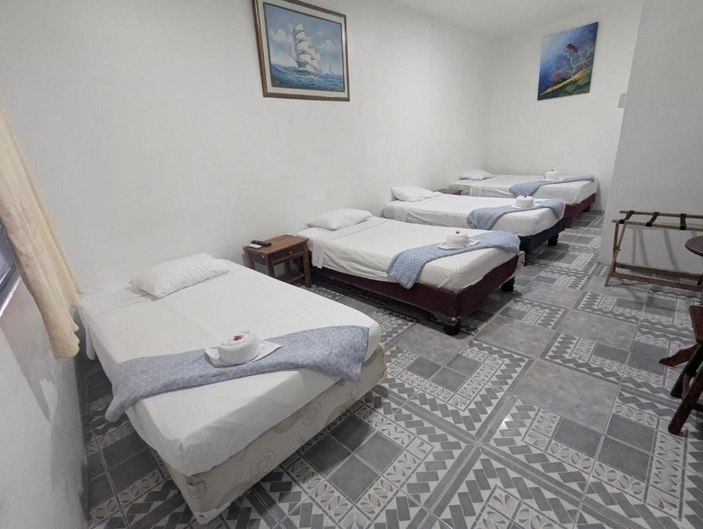 Postel nebo postele na pokoji v ubytování Hostal Gardner