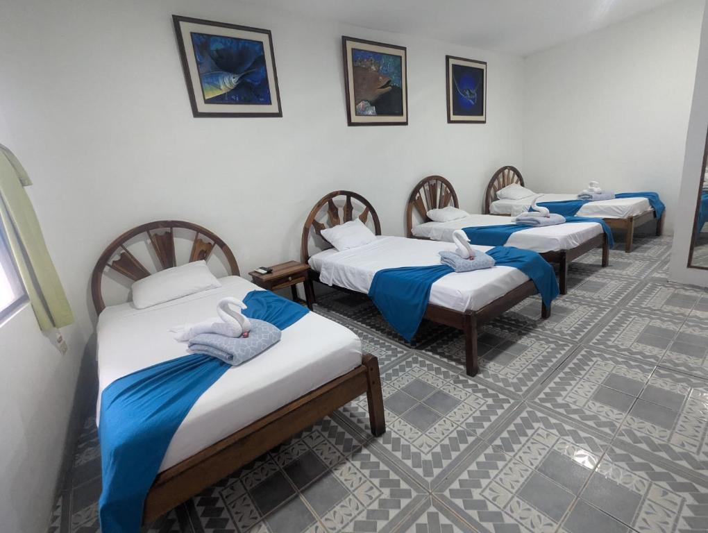 Postel nebo postele na pokoji v ubytování Hostal Gardner