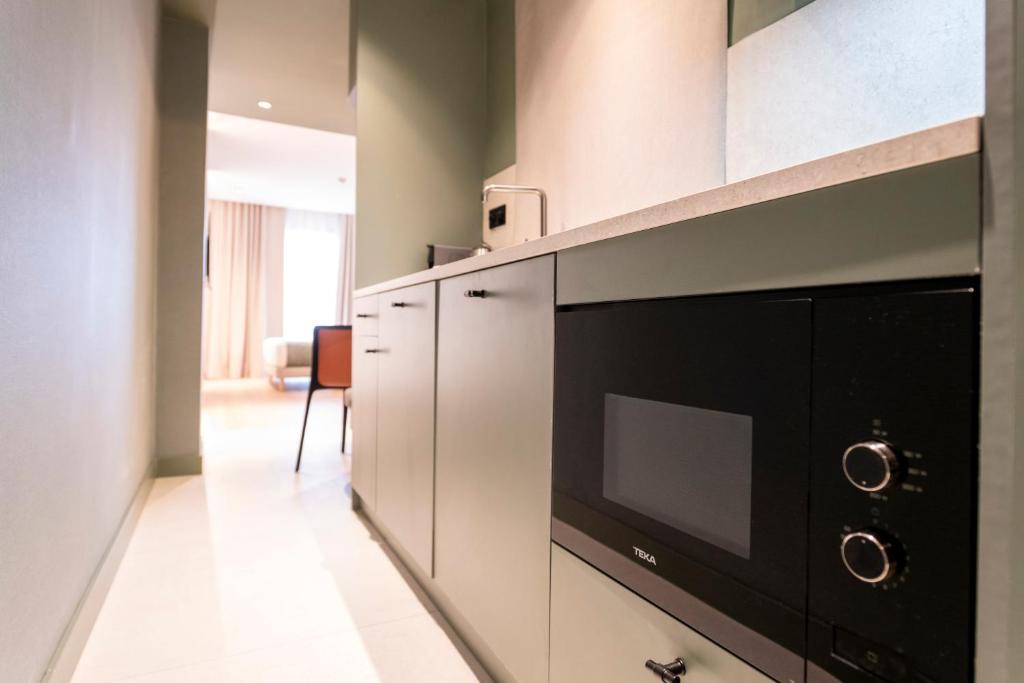 Kuchyňa alebo kuchynka v ubytovaní Aparthotel Atenea Calabria